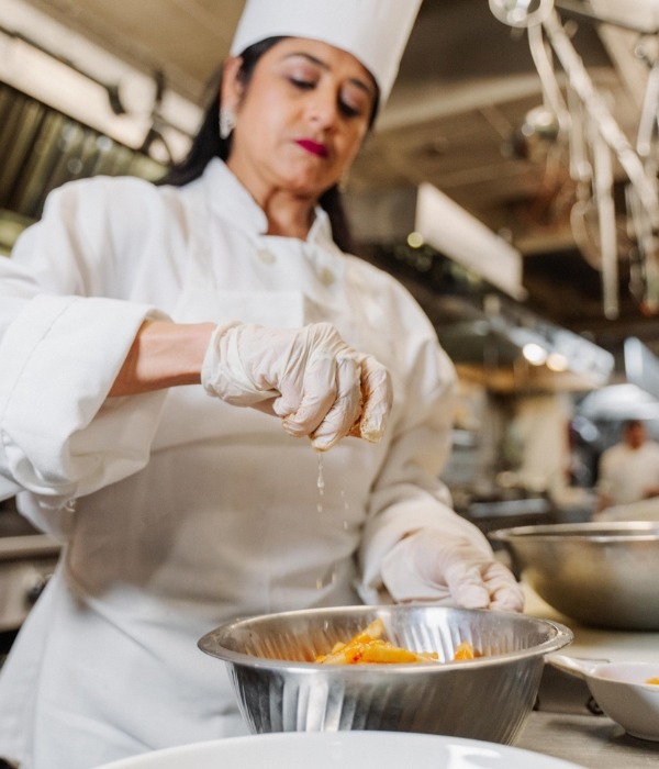 Woman preparing a pasta dish